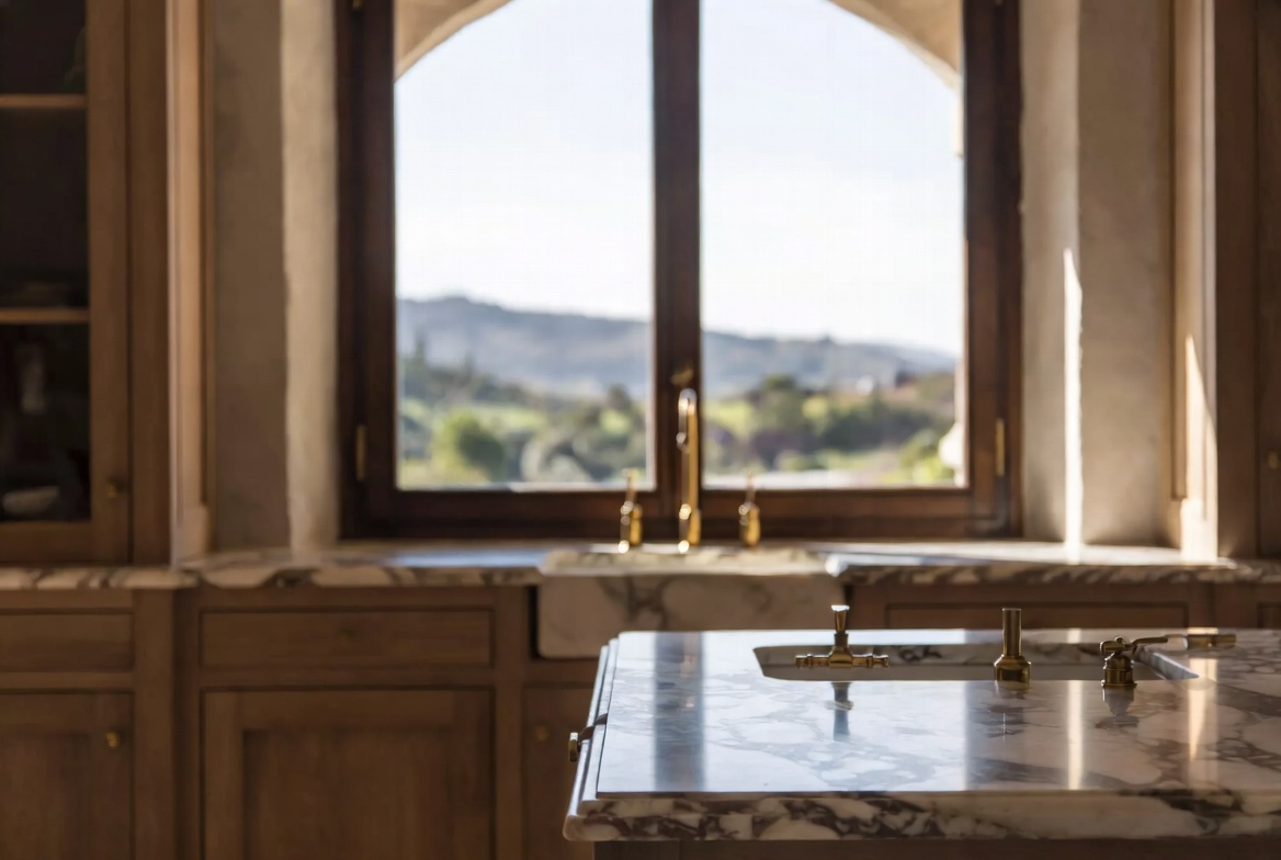 High-end Italian kitchen renovation with marble and artisan details