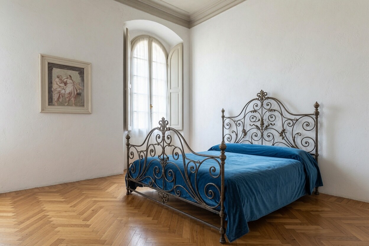 Bedroom with blue bed and preserved 15th-century fresco