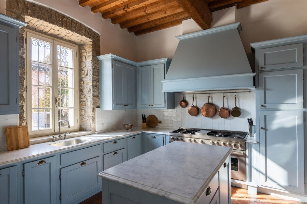 Light blue matte kitchen with Carrara marble